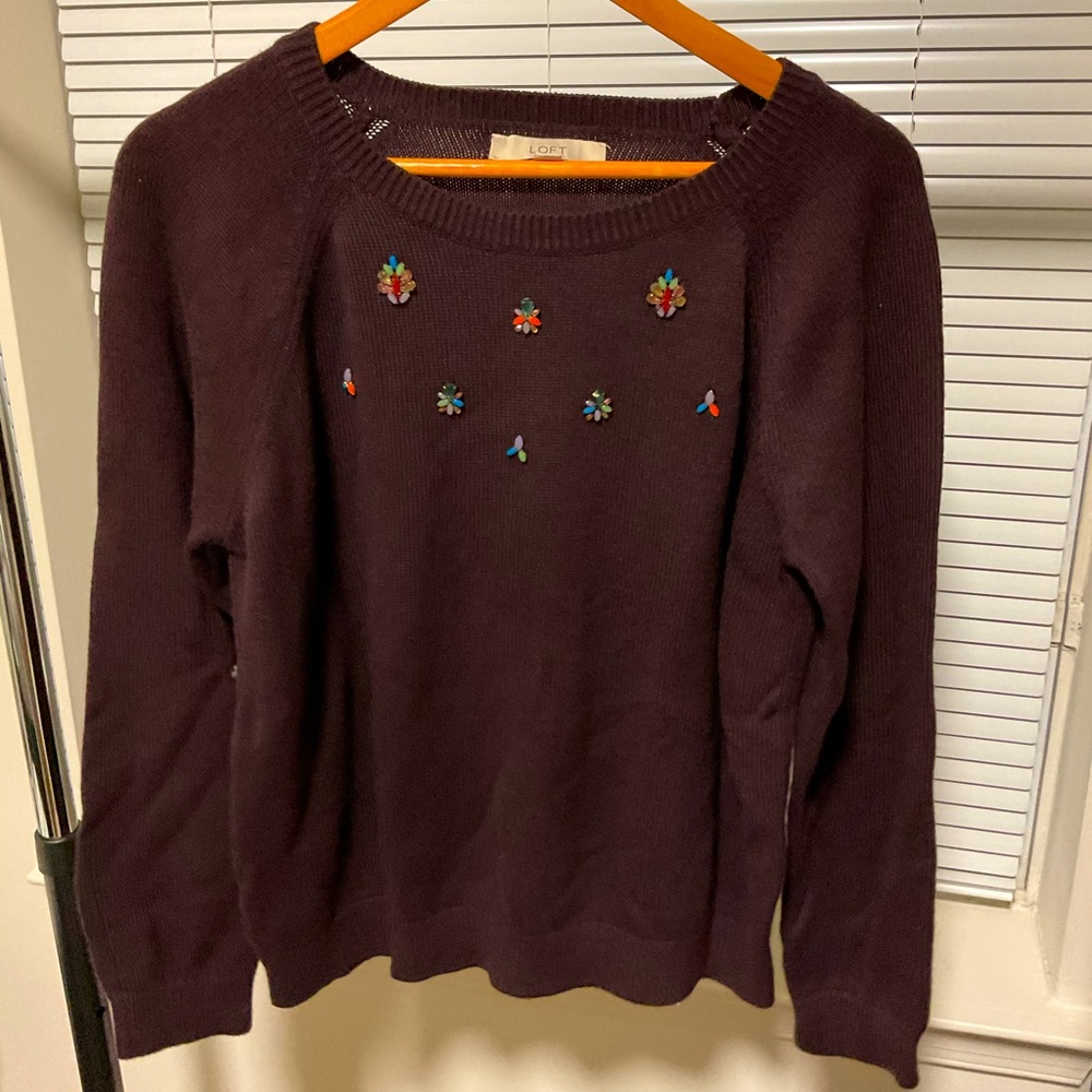 Purple sweater with beaded accessories